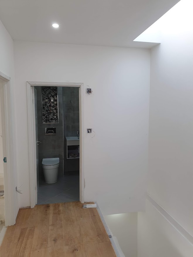 Bathroom installation, flooring, and finishing works in a new build project in West Hampstead by Optima Builders