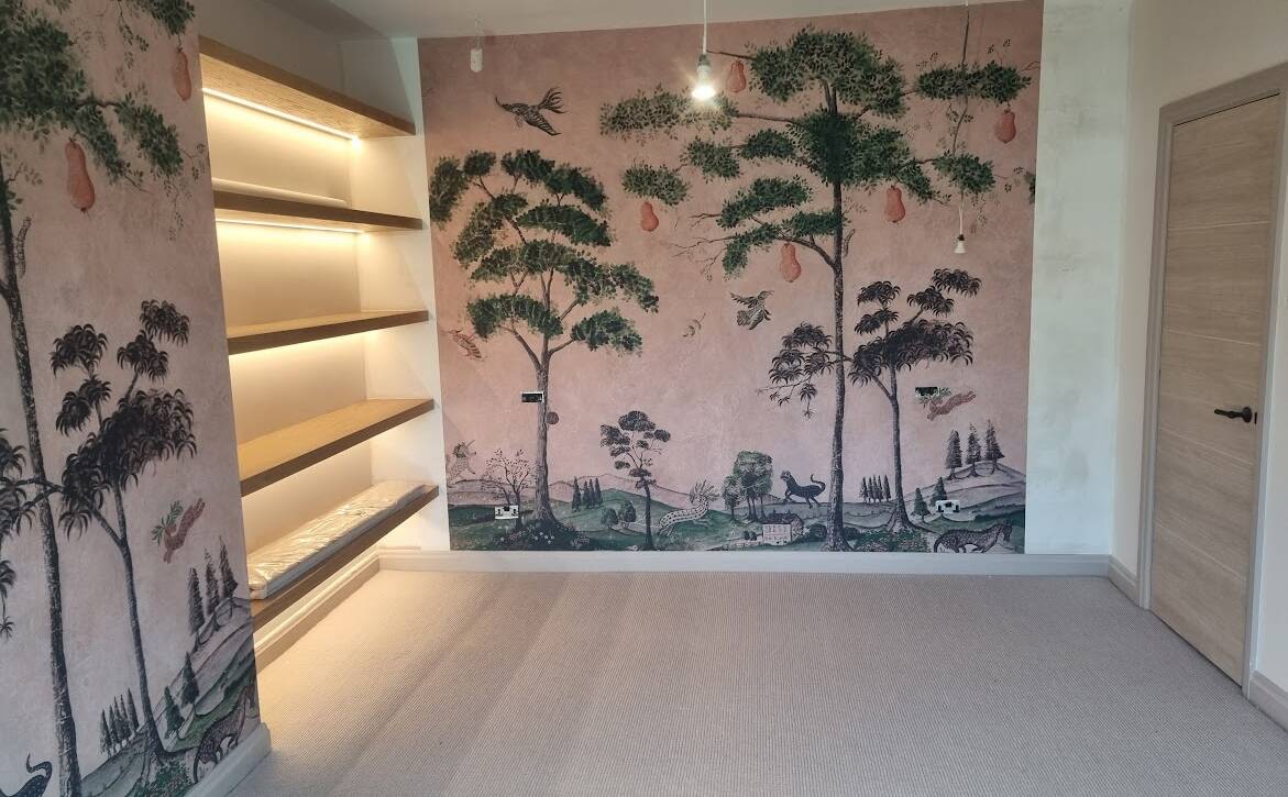 Luxury bedroom with illuminated oak shelves and bespoke wall murals – high-end refurbishment in Mill Hill by Optima Builders